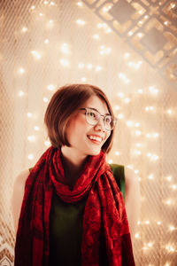 Portrait of asian young beautiful woman on the decorated lights street at night, christmas, winter