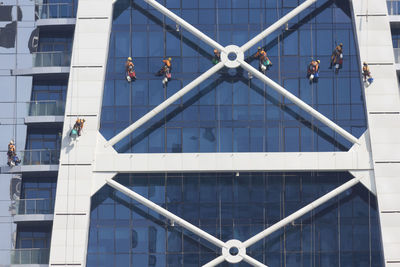 Low angle view of people working in modern building