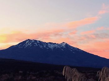 Scenic view of mountains against sky during sunset