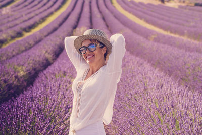 Midsection of woman standing on field