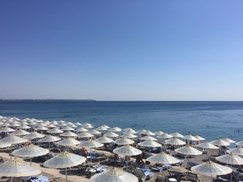 High angle view of sea against clear blue sky