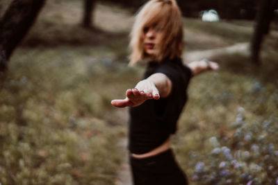 Midsection of woman standing on land