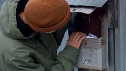 Woman checking mailbox