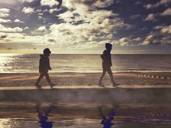 Scenic view of sea against cloudy sky