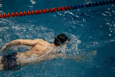 High angle view of swimming in pool