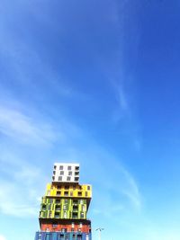 Low angle view of building against blue sky