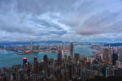 Low angle view of cityscape against dramatic sky