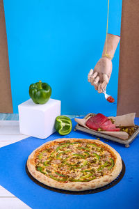Midsection of pizza on table