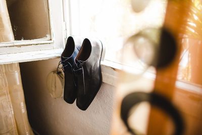 Close-up of shoes on wooden floor