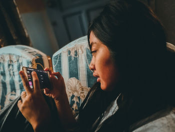 Close-up of woman using mobile phone