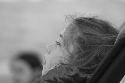 Close-up of woman against blurred background