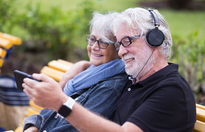 Portrait of woman holding smart phone outdoors