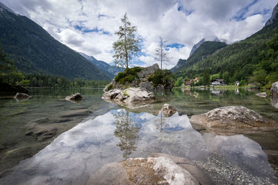 Scenic view of lake and mountains against sky