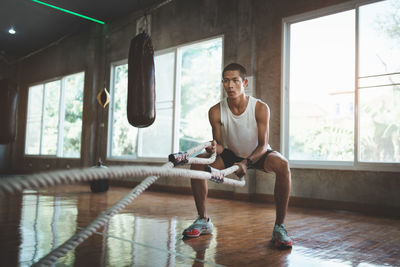 Young woman exercising in gym