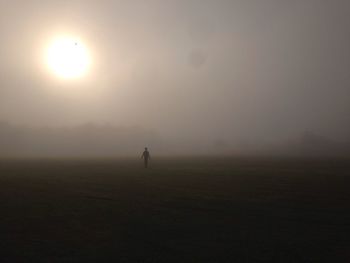 Scenic view of field against sky during sunset