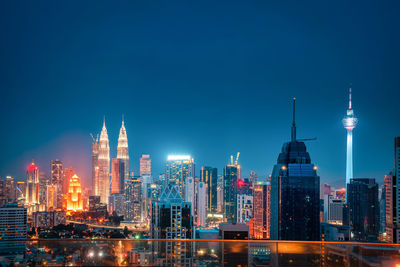 Illuminated buildings in city at night