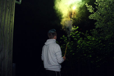 Man wearing mask at night