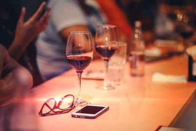 Wine glasses on table at restaurant