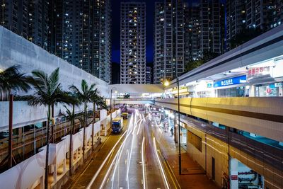 Traffic light trails on road in city at night