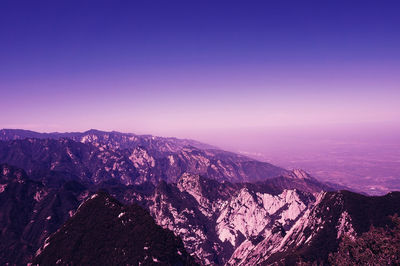 Scenic view of mountains against clear sky at night