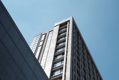 Low angle view of office building against sky