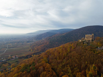 Scenic view of townscape against sky during autumn