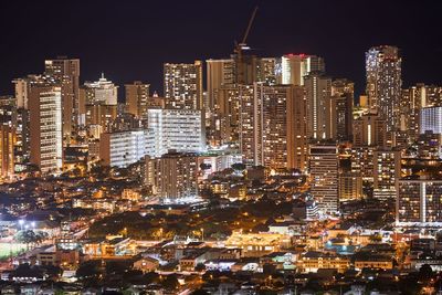 Illuminated cityscape at night