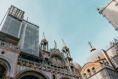 Low angle view of buildings against sky in city