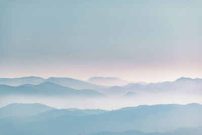 Scenic view of mountains against sky during sunset