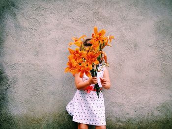 Close-up of woman holding flower