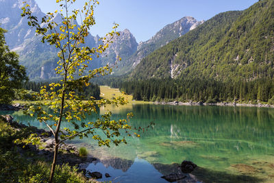 Scenic view of lake and mountains against sky