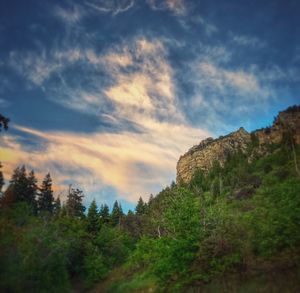 Scenic view of mountains against cloudy sky