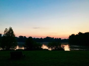 Scenic view of lake against sky during sunset