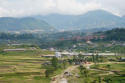 Scenic view of landscape and mountains against sky