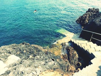 High angle view of rocks in sea