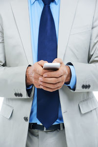 Midsection of businessman giving handshake