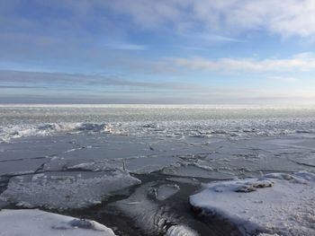 Scenic view of sea against sky during winter