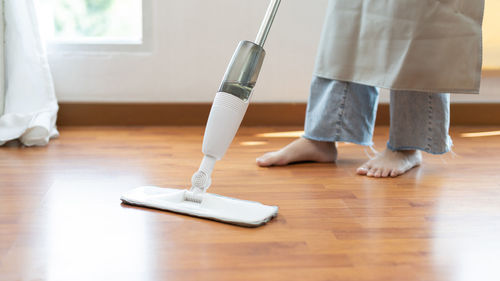 Low section of woman standing on floor