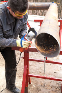 Man working on metallic structure