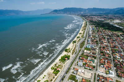 High angle view of sea and buildings against sky