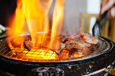 Close-up of meat on barbecue grill