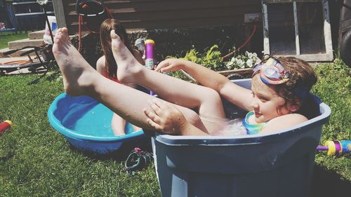 People in swimming pool at yard