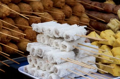 Close-up of skewed food for sale at market