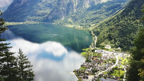 High angle view of calm lake by mountains