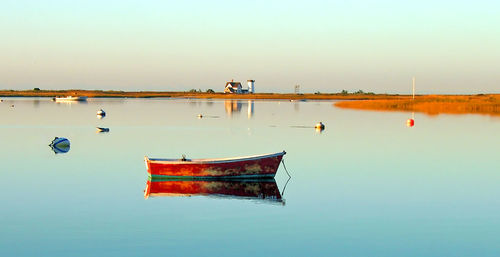 Lighthouse and boat at chatham, cape cod