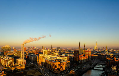 High angle view of buildings against sky during sunset