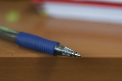 Close-up of pen on table