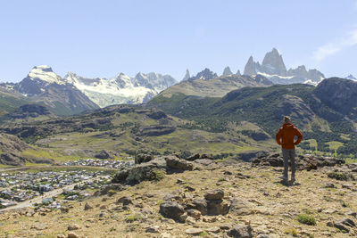 Rear view of man walking on mountain