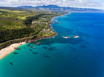 High angle view of sea against blue sky