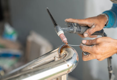 Close up welder is welding thestainless steel in the building site.